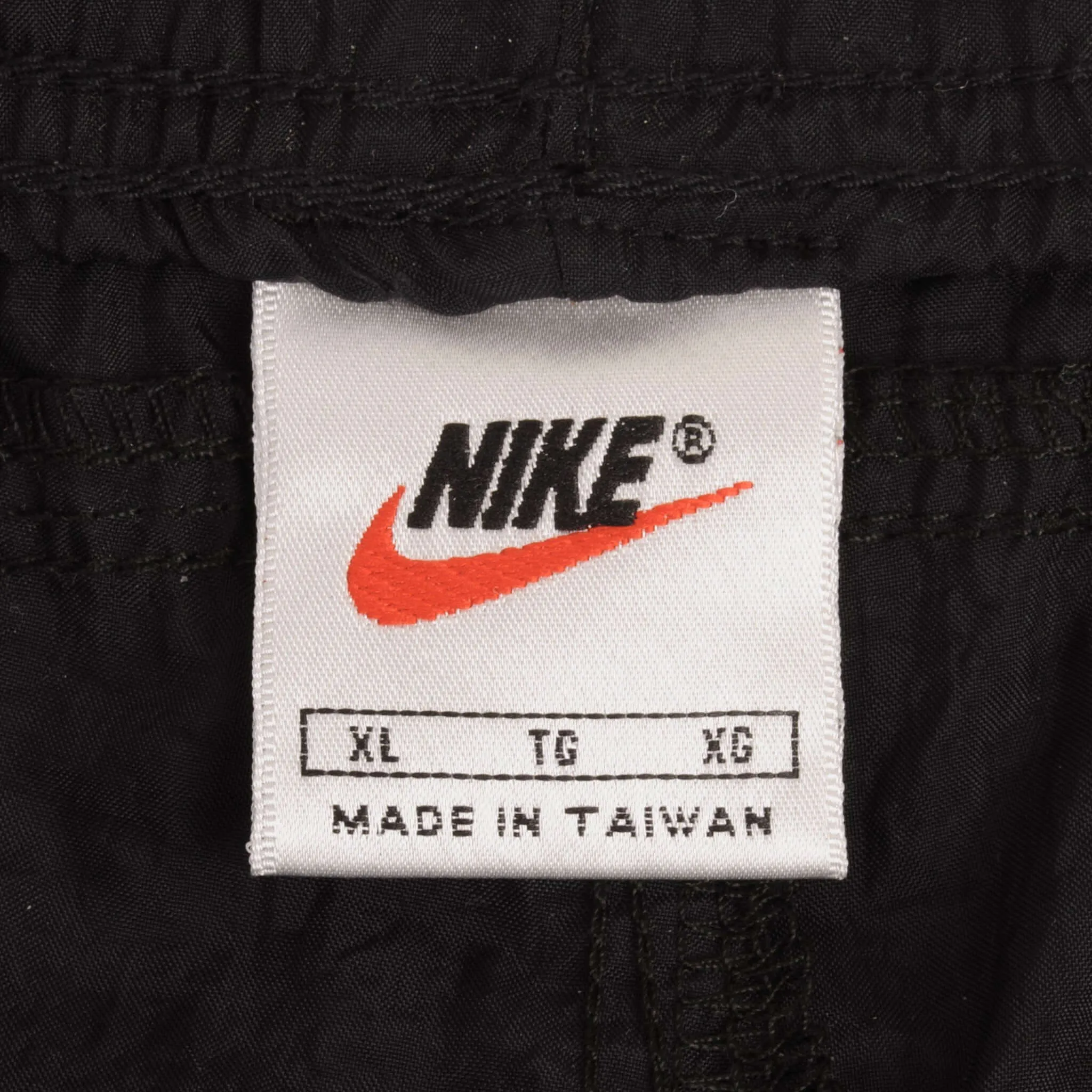 VINTAGE NIKE CLASSIC SWOOSH BLACK NYLON TRACK PANTS 1990S SIZE XL DEADSTOCK
